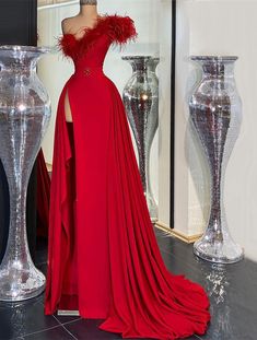 Feathered Floor-length Evening Dress, Formal Floor-length Feathered Gown, Fitted Floor-length Gown With Feather Trim, Red Feathered Evening Dress, Fitted Evening Dress With Feather Trim For Prom, Sleeveless Feather Trim Dress For Homecoming, Red Evening Dresses With Feather Trim, Red Feather Trim Evening Dress, Elegant Prom Gown With Feather Trim