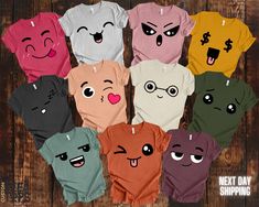 six t - shirts with faces drawn on them