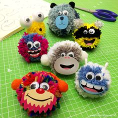 several different types of stuffed animals on a green cutting board with scissors and paper towels