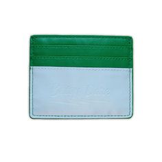 Our slim card wallet fits neatly in any of our bags to hold your cards and enough cash for a cover charge or a drag show. This combination of emerald green, jade, and mint creates a pop of color so vivid you'll outshine any jewels. Smooth vegan leather with contrasting lightning bolt appliqué Holds six cards 3.25" tall by 4" wide (8 cm x 10 cm) Drag Show, Gumball Machine, Green Jade, Lightning Bolt, Chain Strap, Card Wallet, Belt Bag, Emerald Green, Vegan Leather