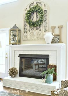 a fireplace with a wreath on top of it