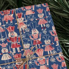 a blue wrapping paper with red and white designs on it