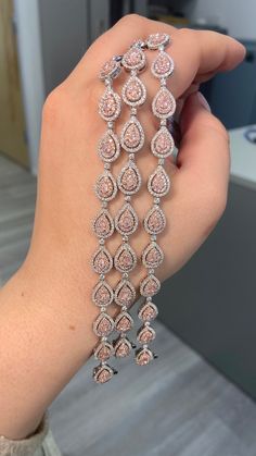 3.98 Carat total weight Natural pink pear shapes F/G color white diamonds VS-SI clarity Set in 18K White Gold 7 inches Exceptional Craftsmanship Pink Diamond Bracelet, Pear Shapes, Rare Colors, Candy Christmas Decorations, Baddie Makeup, Pear Shaped Diamond, Pink Diamond, Diamond Bracelets, Indian Jewellery