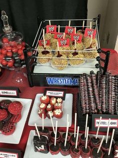 a table topped with lots of desserts and candies