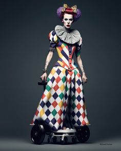 a woman dressed in clown makeup and holding a ball on top of a skateboard