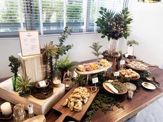 the table is covered with many different types of food