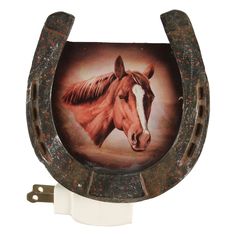 a horse's head is painted on the side of a wall mounted toilet paper dispenser