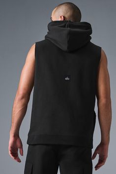 Stay cozy without sacrificing style in the Renown Sleeveless Hoodie. It has deep armholes, a kangaroo pocket, and a laid-back cut. And wait till you feel the Alo signature Renown fabric—it's smooth on the outside, a little fleecy on the side, and heavyweight for a just-right drape. Add shorts and you’re covered from the gym to the street. Alo Yoga Cotton Activewear Sportswear, Alo Yoga Cotton Sportswear, Black Cotton Sportswear Tank Top, Black Cotton Tank Top Sportswear, Black Cotton Tank Top For Sportswear, Casual Black Tank Top With Dropped Armholes, Black Sporty Activewear With Dropped Armholes, Sporty Black Activewear With Dropped Armholes, Alo Yoga Cotton Athleisure Activewear