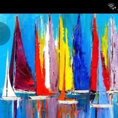 colorful sailboats floating in the water on a sunny day