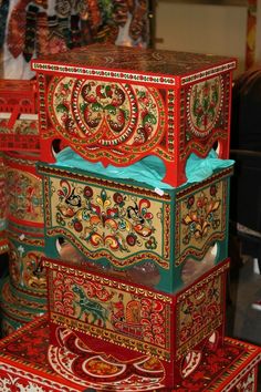 an elaborately painted chest on display in a store