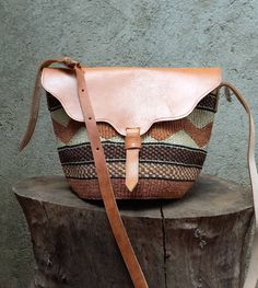 Size 8 inches base diameter  and 8 inches height.  Sisal purse with a leather flap. Handwoven  with long strap  that can be carried across the body or over the shoulder. Brown Artisan Saddle Shoulder Bag, Brown Woven Satchel For Everyday Use, Brown Leather Trim Crossbody Saddle Bag, Brown Leather-trim Shoulder Flap Bag, Brown Flap Shoulder Bag With Leather Trim, Everyday Brown Woven Satchel, Brown Satchel Flap Bag With Leather Trim, Brown Leather Trim Saddle Shoulder Bag, Artisan Brown Handmade Saddle Bag