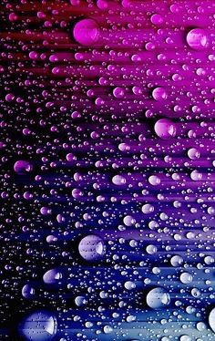 purple and blue water drops on black background