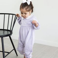 The Purple Stripe Romper is a delightful choice for playtime during cooler weather! Designed with comfort in mind, this long sleeve knit romper is not only perfect for school and playtime but also transitions seamlessly for various occasions. It features a stylish collar with picot trim and convenient snaps in stride. Whether it's a casual outing or a day at school, this romper ensures both style and comfort. Elevate its charm by adding a monogram, making it uniquely adorable. Patriotic Swimwear, Knit Romper, Bubble Dress, Boys Swimwear, Pajama Pant, Knitted Romper, Striped Rompers, Cooler Weather, Swimwear Girls