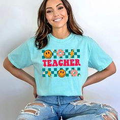 Looking for a cute versatile top to wear this summer? Make sure to grab one of our Retro Teacher Checkered garment dyed graphic tees! This soft and comfortable graphic tee is the perfect top for any outfit. It can be paired with biker shorts, jeans, or even a simple skirt/dress! This tee is true-to-size, so be sure to order your regular t-shirt size! If you are looking for a more oversized look, make sure to size up! Casual Fit, Casual Fits, Vintage Look, Heavy Weight, Air Dry, Vintage Looks, Comfort Colors, Chambray, Size Guide