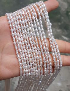 "3-5mm Grade AA High Quality Natural Freshwater Baroque Seed Nugget Keshi Pearl Beads - White 14.5\" strand PB850 Material genuine freshwater pearl, fully drilled Qty 1 strand/PKG, 14.5 inches around Color white Size 3-5mm Good luster Please note that it is estimated size More quanity? Wholesale price? Convo us!" Pearl White Baroque Pearl Beaded Necklace With Round Beads, Pearl White Baroque Pearl Beaded Necklaces, Pearl White Baroque Pearl Beaded Necklace, White Pearl Necklace With Spacer Beads, White Pearl Necklace With Gemstone Beads, Hand-strung White Pearl Necklace For Wedding, White Polished Bead Pearl Necklace, White Pearl Beaded Necklace In Rondelle Shape, White Pearl Beaded Necklaces In Rondelle Shape