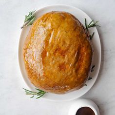 a loaf of bread sitting on top of a white plate