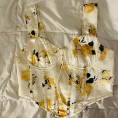 Yellow And Navy Blue Floral Print Bustier Top! Never Worn* Perfect Condition, It’s A Size Medium But Runs Like A Small! Fitted Yellow Crop Top, Chic Fitted Yellow Crop Top, Fitted Yellow Floral Print Crop Top, Yellow Floral Top, Yellow Top, Flower Tops, Blue Floral Print, Bustier Top, Shein Tops