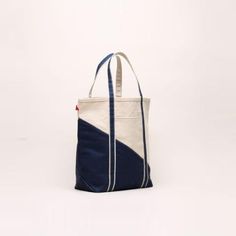 *Available for US customers only* Grab your keys, tickets, beach pass, and this great Contemporary Boat Bag! No matter where your travels take you, you can be fully prepared with all your essentials packed away in this classic navy striped tote. Perfect for air travel, road trips, sailing, train rides, amusement parks, beach days, hotel stays, pool days, lakeside afternoons, and family vacations. Artisan's Description: Our signatures with a twist of the contemporary diagonal sail design! Nothing Brogues Womens, Boat Bag, Boat Tote, Puffer Jacket Men, Mens Lightweight Jacket, Joggers Shoes, Classic Boat, Oxford Brogues, Dressy Sandals