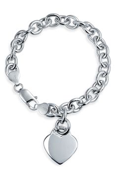 A gleaming heart charm dangles from a sterling silver chain, creating a beautiful bracelet that is the perfect gift for your sweetheart. Sterling silver chain bracelet with heart charm. Lobster clasp. Approx. 7.5" chain length. Imported Classic Sterling Silver Heart Bracelet For Valentine's Day, Elegant Heart Charm Bracelet With Sterling Silver Clasp, Elegant Dangle Charm Bracelet For Valentine's Day, Classic Sterling Silver Heart Charm Bracelet, Classic Sterling Silver Charm Bracelet With Heart, White Gold Heart Charm Chain Bracelet For Anniversary, Classic White Gold Charm Bracelet With Heart Charm, Elegant Sterling Silver Double Heart Charm Bracelet, Classic White Gold Charm Bracelet With Heart