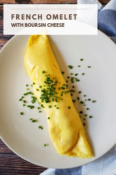 french omelet with bourssin cheese on a white plate