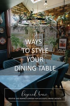 a dining table with blue chairs in front of a window and the words, ways to style your dining table