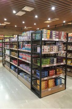 a grocery store filled with lots of food and drinks on shelve shelves next to each other