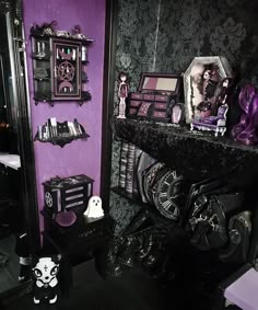 a purple and black room with lots of decorations on the wall, including an ornate mirror