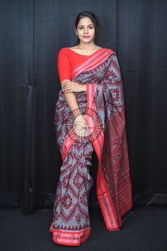 Weaver communities of Maniabandha and Nuapatana of Odisha traditionally weave this kind of saree. Common motifs are star, temple, conch, rudraksh, fish, chakra, lotus etc. The inspiration of all its designs comes from nature. It is the best of single ikat; one of warp and weft is tied and dyed prior to weaving. The borders and the pallas have tremendous variety and each one of them is attractive and praiseworthy. Specification:  Occasion: Festive Wear Fabric: Khandua Cotton Primary Color: Grey S Red Handloom Traditional Wear For Ceremonial Occasions, Red Handloom Traditional Wear For Ceremonial, Red Traditional Wear With Woven Motifs For Festivals, Traditional Pre-draped Saree With Weaving For Festivals, Traditional Wear With Woven Motifs For Puja And Festivals, Traditional Wear For Puja With Weaving Work, Red Handloom Pre-draped Saree For Transitional Season, Red Saree With Weaving Work For Traditional Ceremonies, Traditional Red Dupatta With Weaving Work