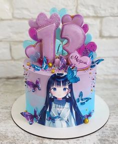 a birthday cake decorated with butterflies and the number 13 on it's top is pink