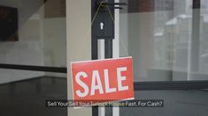 a red sale sign hanging from the side of a glass door that says sell yourself your house fast for cash