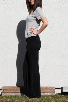 "Comfy and easy black wide leg pants you can wear more than lounging and exercise Fold over waist with side draw strings Fitted over knees and flares beautifully at the bottom Wear it around town for easy walk or shopping at farmers market -Fits like glove -Wide bottom -Double layered waist panel goes under the chest. It can be worn as a maternity pants in this way. -Draw Strings attached on both waist sides to create shirring when they are pulled -Waist sits below naval when the double layered Black Stretch Maternity Pants, Stretch Black Maternity Pants, Black Stretch Maternity Bottoms, Stretch Black Maternity Bottoms, Stretch Black Bottoms For Maternity Wear, Fitted Black Maternity Bottoms, Chic Black Stretch Harem Pants, Casual Black Maternity Bottoms, Black Full Length Yoga Pants For Spring