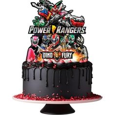 a birthday cake with an image of power rangers on top and the words dino fury above it