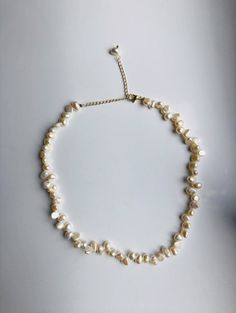 A stunning piece of Baroque style real pearl necklace. The freshwater pearls are completely natural and hand-made with 14k gold-filled chains. The chains are adjustable and fit most necks. No matter it's an elegant wedding or fancy Friday evening, it will definitely make you shine out of the crowds. Perfect for brides or your loved friends. Some highlights of this beautiful irregular shaped pearl beaded necklace are : *High quality guaranteed. Real natural pearls, handmade with 14k gold-filled c Delicate Single Strand Baroque Pearl Necklace, Adjustable Delicate Baroque Pearl Necklace, Delicate Baroque Pearl Necklace With Round Beads, Adjustable Baroque Pearl Necklace, Dainty Baroque Pearl Necklace In Pearl White, Wedding Beaded Necklaces With Baroque Pearl Drop, Wedding Baroque Pearl Beaded Necklaces With Pearl Drop, Wedding Baroque Pearl Beaded Necklace With Pearl Drop, Delicate Pearl Necklace For Jewelry Making