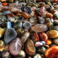 many different colored rocks are stacked on top of each other