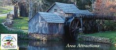 an old water mill with the words area attractions on it's front and side