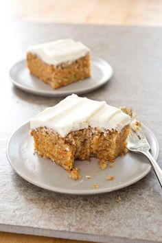 two slices of carrot cake with white frosting