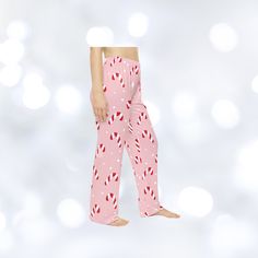 Get cozy and festive with these Candy cane Christmas pajama pants, perfect for lounging around during the holiday season. The soft fabric and elastic waistband provide comfort while the Christmas design adds a touch of cheer to your sleepwear. Ideal for women looking for a cozy and festive option for the holiday season. Product features - 100% Polyester fabric for durability and quick drying - Size and care label inside waistband for convenience - Soft hand-feel and smooth printing canvas - 100% brushed polyester material for comfort - Assembled in the USA from globally sourced parts Care instructions - Do not dryclean - Do not iron - Tumble dry: low heat - Do not bleach - Machine wash: cold (max 30C or 90F) Christmas Holiday Long Pants Sleepwear, Christmas Holiday Sleepwear With Long Pants, Christmas Pajama Party Sleepwear Long Pants, Christmas Sleepwear For Pajama Party With Relaxed Fit, Pink Cotton Sleepwear For Holiday, Pink Cotton Christmas Sleepwear, Casual Christmas Sleep Bottoms, Christmas Cotton Sleep Pants, Cotton Pants For Christmas Loungewear