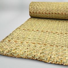 a roll of woven material on top of a table