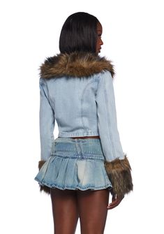 This jacket has a denim construction with a faux fur notched lapel collar, faux fur cuffs, chest pockets with button closures, and front button closures. Denim Outerwear With Faux Fur Trim, Trendy Denim Outerwear With Faux Fur Trim, Winter Denim Jacket With Faux Fur Lining, Denim Outerwear With Faux Fur Trim For Fall, Fall Denim Outerwear With Faux Fur Trim, Fall Denim Jacket With Faux Fur Trim, Winter Denim Jacket With Faux Fur Trim, Long Sleeve Denim Jacket With Faux Fur Lining, Denim Jacket With Faux Fur Lining And Long Sleeves