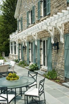 an outdoor patio with tables and chairs