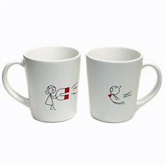 two white coffee mugs with stick figures drawn on the inside and outside of them