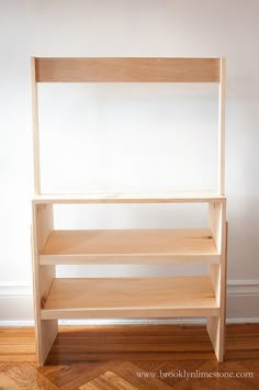 a wooden shelf sitting on top of a hard wood floor