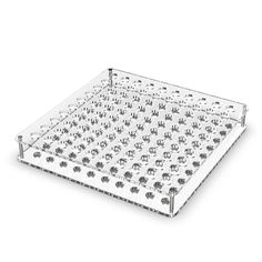 a clear plastic tray with lots of holes in it