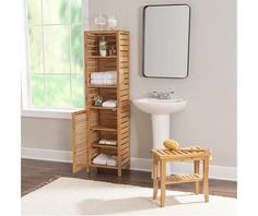 a bathroom with a sink, mirror and wooden storage unit in it's corner