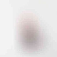 a blurry image of a white object in the air