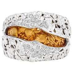 An artistic fashion ring signed by Carrera y Carrera, featuring an open and close portion that reveals a sculpture of Romeo and Juliet in 18K yellow gold. Accented by a floral motif on 18K white gold, encrusted with round brilliant cut diamonds weighing 0.27 carat total. Size 6 US. Perfect gift to give to a loved one for a special moment. This ring is from a collection that is devoted to the value of love as an essential and eternal component of life. Carrera Y Carrera Jewelry, Romeo Und Julia, Artistic Fashion, Interesting Jewelry, Chic Leather, Diamond Gold, Fashion Ring, Artist Style, Romeo And Juliet