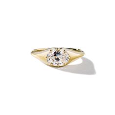 Evoking the quintessential signet setting, this brilliant cut oval diamond is held by eight clawed prongs, a signature style of ILA. With recycled gold and sustainable craftsmanship, this engagement ring is informed by a deep appreciation of the earth and its beauty. Dimensions: Pictured in a 1.0ct diamond; Band Width 2.0mm, Diamond Height 1/8" Delivery: This item is made to order. Please allow up to 3-4 weeks for delivery. Classic Oval Signet Ring With Rose Cut Diamonds, Elegant Oval Signet Ring With Rose Cut Diamonds, Diamond White Oval Brilliant Cut Signet Ring, Oval White Gold Signet Ring With Prong Setting, Oval Diamond White Signet Ring With Brilliant Cut, Classic Oval Diamond Signet Ring, Refined Oval Ring With Single Diamond, Luxury Oval Solitaire Signet Ring, Timeless Oval Solitaire Signet Ring