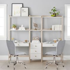 two white desks with chairs in front of a bookcase and shelves filled with books