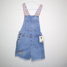 Target Pride Shortalls Sz Xs Adult Rainbow Light Wash Nwt "Queen" And Rainbow Design. Type: Shortall Jumper Style: Shorts Brand: Target Pride Size: Xs Material: Cotton, Spandex Color: Blue Measurements: Waist: 32" Inseam: 5" Condition: New With Tags No.: B2b - 668 Wt.: 1.2 Oz. Please Check The Measurements, Pictures, And Description. Send Us An Offer! Thank You For Looking And Check Out My Other Items! Cute Denim Overalls For Summer, Cute Spring Shortalls Overalls, Cute Spring Overall Shortalls, Cute Spring Shortalls Overall, Cute Sleeveless Overalls With Pockets, Trendy Blue Cotton Shortalls, Cute Blue Summer Overalls, Blue Cotton Shortalls For Spring, Cute Blue Sleeveless Overalls