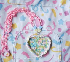 "Polymer clay pastel marshmallow twist heart filled with a transparent \"glass\" film with sprinkles inside The marshmallow border is sealed with a satin glaze   Perfect for everyday kawaii and fairy kei looks! The heart measures approx 2.5 inches long and 2.75 inches across, chain hangs approx 11 inches long with a plastic heart-shaped lobster clasp Please message me if you have any questions or concerns. PLEASE NOTE: ** Polymer clay is waterproof, washable, and durable however please understand that doesn't mean it is indestructible so please take care as you would any other jewelry piece All of my items are handmade and therefore are subject to slight imperfections but please know they were created and treated with the utmost care and love. I would never sell anything that I myself woul Decora Kei Outfits, Kei Jewelry, Pastel Jewelry, Necklace Fairy, Yume Kawaii, Twisted Heart, Cute Stuff, Glass Film, Heart Necklace